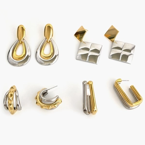 Set of four stylish gold and silver two-tone geometric earrings in various trendy designs