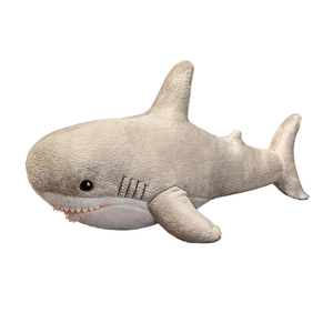 Gray and white plush shark toy with detailed fins and soft texture on white background