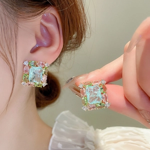Elegant gold earrings with light blue rectangular zircon and colorful floral gemstones
