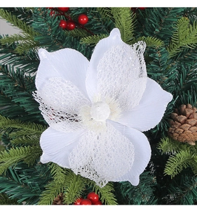 Detailed view of white glitter poinsettia flower with lace petals for Christmas decor