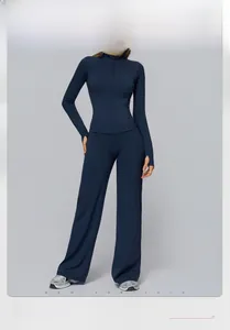Detail of navy blue high-waist wide-leg yoga set and zip-up jacket with thumbholes