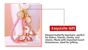Detailed macro view of pink crystal butterfly keychain with golden alloy and woven strap