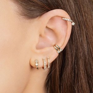 Gold-plated geometric hoop earring set with cubic zirconia and opal on female ear