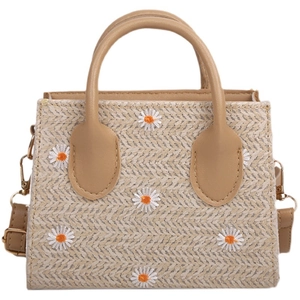 Handmade woven straw crossbody bag in beige featuring delicate white daisy embroidery