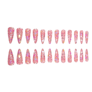 Macro view of long stiletto press-on nails with pink glitter and colorful sequins