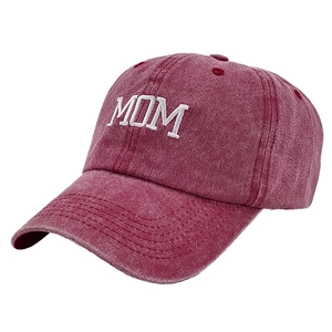 Close-up of white MOM embroidery on vintage burgundy washed cotton baseball cap