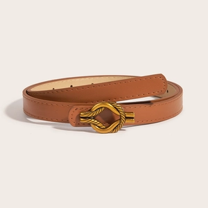 Chic brown leather belt for women with elegant gold knotted buckle on beige background