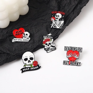 Gothic skull enamel pins set with Dead Inside text on black crumpled paper background