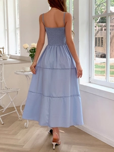 Light blue spaghetti strap maxi dress with smocked back and tiered skirt for summer