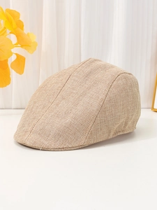 Detailed close-up of khaki linen newsboy cap showing breathable textured fabric weave