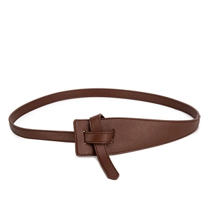 Detail of dark brown leather wrap belt featuring pebbled texture and tie-knot design