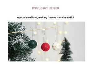 Embroidered wool felt Christmas ornaments in red and green hanging on a wooden stick