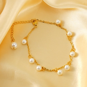 Elegant 18K gold plated stainless steel anklet featuring white pearls on silk background