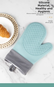 Close-up of light blue silicone oven mitt with non-slip texture and grey canvas cuff