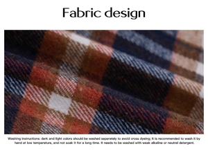 Detail of blue and orange plaid flannel fabric with English washing instructions label