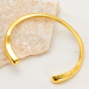 Irregular 18K gold plated titanium steel open bangle with minimalist mirror finish