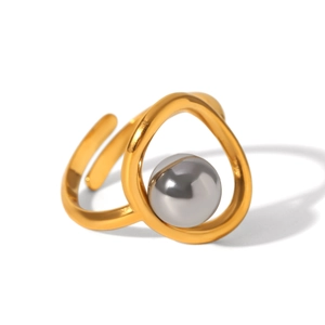 Detail view of gold geometric open ring featuring a grey pearl inlay and irregular lines