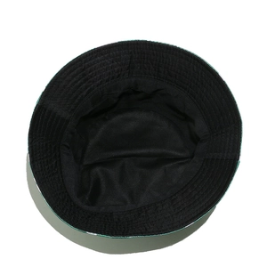 Detailed view of black bucket hat interior with reinforced green stitching and durable fabric