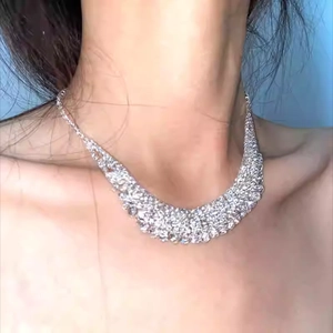 Sparkling multi-row rhinestone fringe bib necklace in silver finish for evening wear