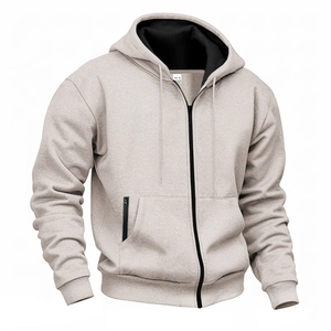 Detailed close-up of men's fleece hoodie lining and M size tag on beige fabric