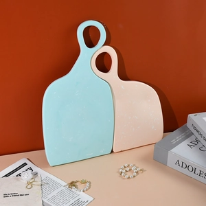 Modern resin tray set in mint green and pink with speckled texture and round handle