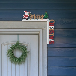 Close-up of wooden Christmas door frame decor featuring Santa and Merry Christmas text