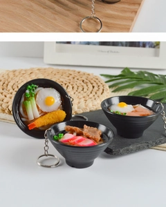 Macro detail of Japanese udon noodles keychain with shrimp tempura and miniature egg