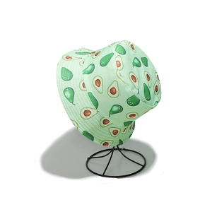 Close-up of a light green bucket hat featuring all-over tropical avocado fruit prints