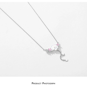 Close-up of S925 silver necklace featuring shell flower pendant and pink crystal accents