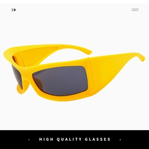 Detail of yellow futuristic wrap-around sports sunglasses with dark grey UV lenses