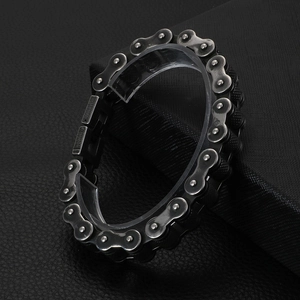 Macro shot of industrial motorcycle chain bracelet in gun black finish on leather