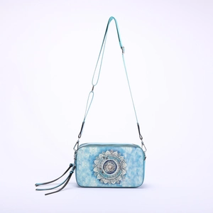 Light blue crossbody bag with mandala print, adjustable strap and tassel charm detail