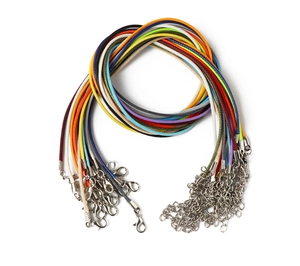 Close-up of colorful braided wax cords with lobster clasps for DIY jewelry making
