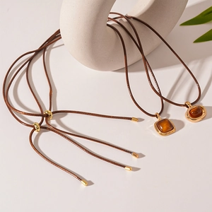 Retro resin pendant sweater chain with amber square and oval charms on brown cord