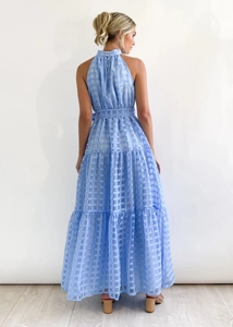 Back view of light blue checkered organza maxi dress with tiered skirt and neck tie