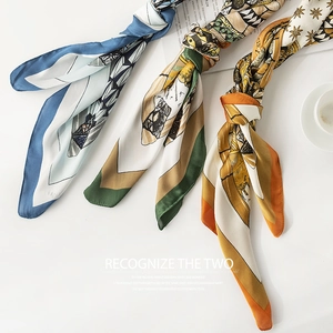 Three elegant leopard and silk-like scarves in blue, green and gold with geometric patterns
