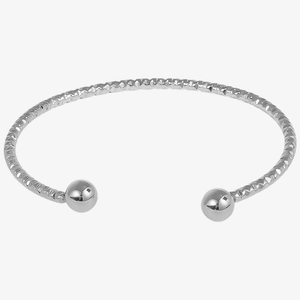 Detailed close-up of a silver stainless steel open bangle with textured geometric patterns
