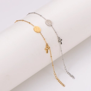 Minimalist stainless steel bracelet with oval medal and hollow cross charms in gold and silver