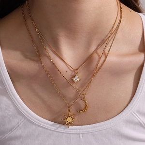 Layered 18K gold plated stainless steel necklace featuring sun moon and star pendants