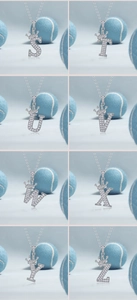 Detail view of silver crown initial pendants from S to Z with sparkling zircon pavé