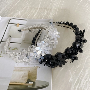 Detailed view of beaded flower headbands in black and transparent crystal acrylic beads