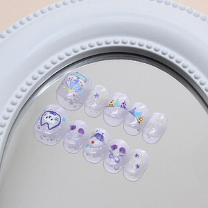 Sparkly purple cat eye press-on nails with cartoon cat and colorful star patterns