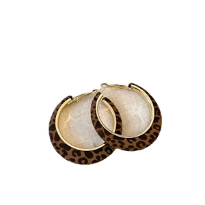 Chic leopard print flocked hoop earrings with golden inner lining and retro style