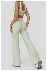 Back view of mint green high-waisted flare yoga set with contrast binding and racerback bra
