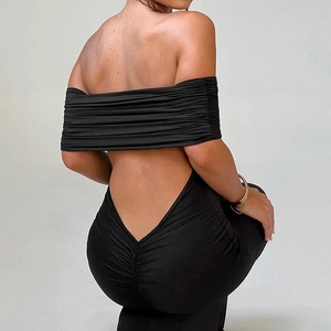 Detail view of backless design and ruched fabric on the black off-shoulder dress