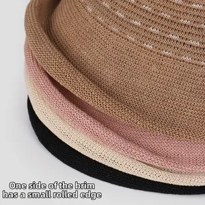Detail of multi-color linen knit bucket hats showing rolled brim and woven texture