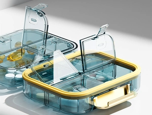 Detail of portable 4-compartment pill organizer with silicone seal and golden latch