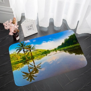 Detailed view of flannel absorbent floor mat with tropical palm tree scenery on wood floor