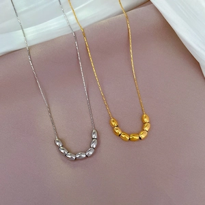 Titanium steel necklaces with gold and silver bead pendants on thin snake bone chains