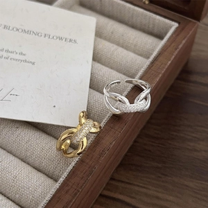 Adjustable 925 sterling silver interlocking rings with pave diamonds in a wooden box
